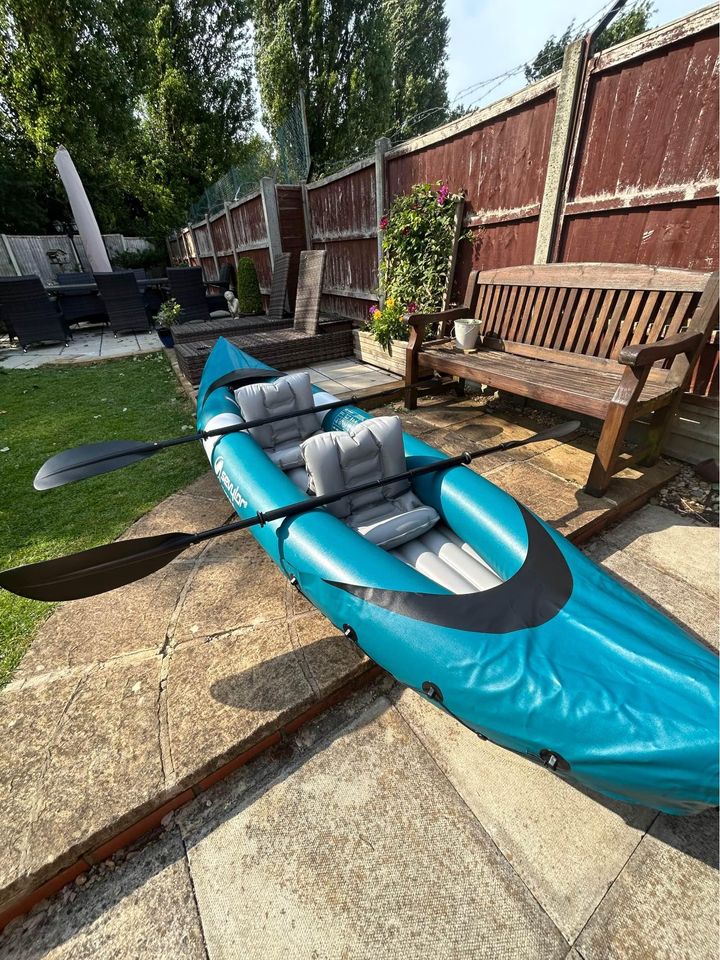 Inflatable double kayak with paddles